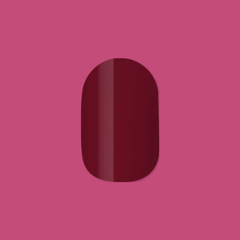 Vineyard | Short | Round - Tab Press-On showing deep wine red false nail with glossy finish on pink background