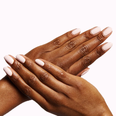 Hand holding a bottle of GH nail polish in an opaque baby pink perfect for a glowy, versatile manicure at home GH baby pink Nail Polish