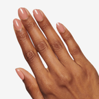 Hand with glossy nude manicure showcasing Long Lasting Top Coat for durable at-home mani shine and protection