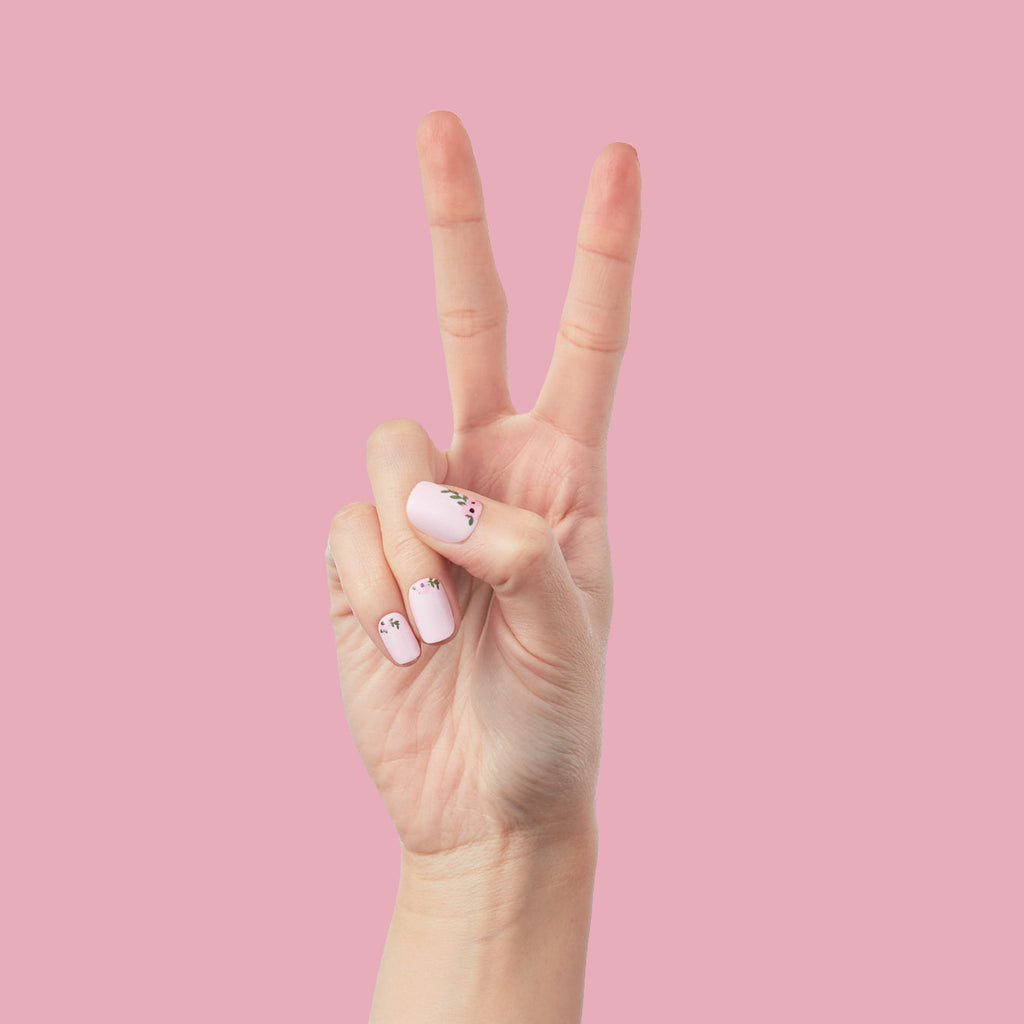 Wild Bouquet - Press-On | Short | Squoval short nails with light pink base and delicate wildflower details on hand against pink background