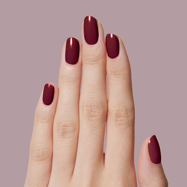 wrapped in rubies - dark burgundy & gold nail polish color - essie