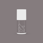 Olive and June AW nail polish bottle in warm grey shade on matching background for mani and manicure use