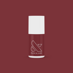Bottle of JJ nail polish by Olive and June in a rich cinnamon brown shade for at-home manicures and pedis