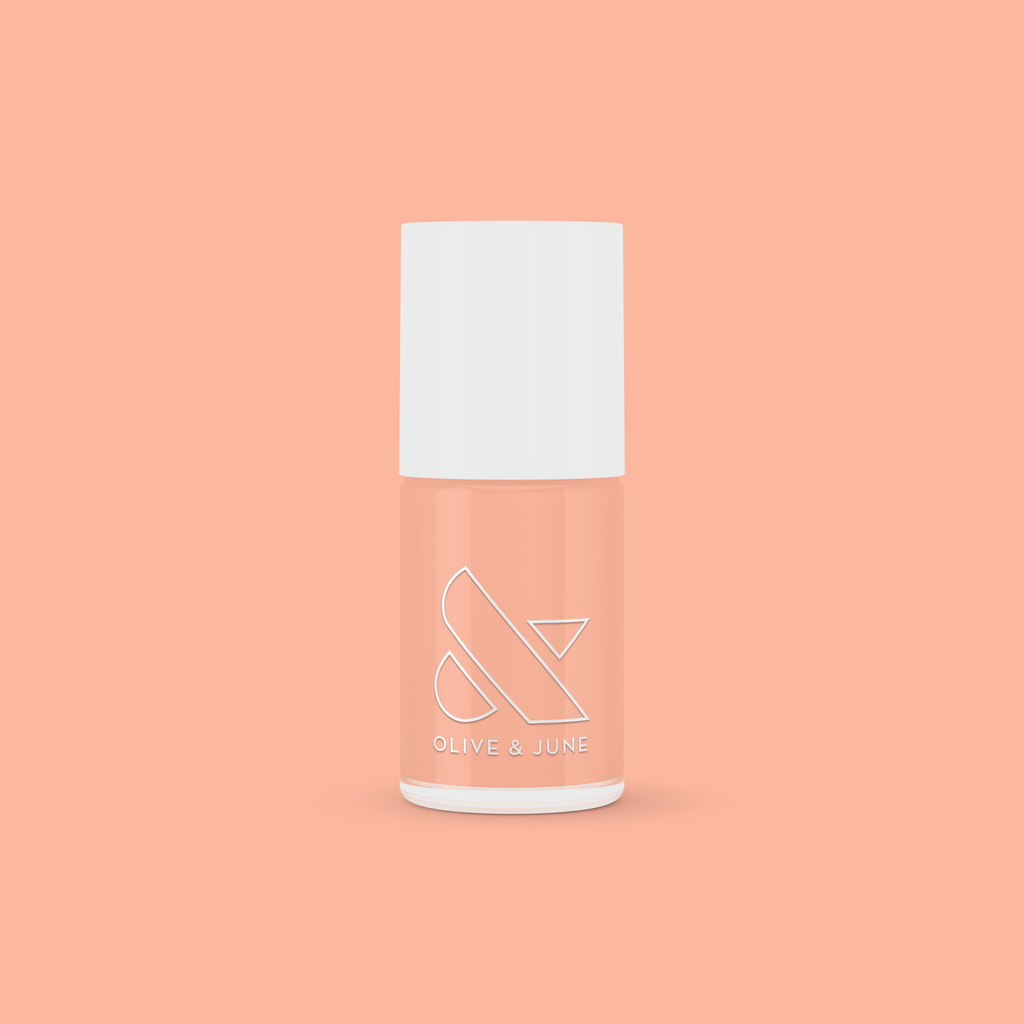 Olive and June JO nail polish bottle in a dusty apricot shade perfect for at-home manicures and quick-dry polish looks