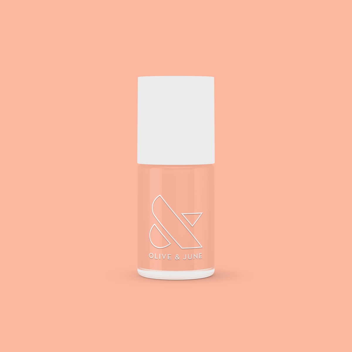 Olive and June JO nail polish bottle in a dusty apricot shade perfect for at-home manicures and quick-dry polish looks
