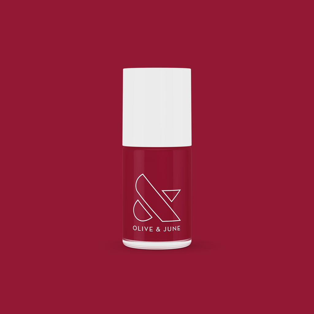 Olive and June’s SC nail polish bottle in rich deep bordeaux shade for sophisticated at-home manicures
