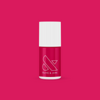 XOXO nail polish bottle in bright hot pink shade on matching pink background for vibrant manicure looks