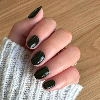 It’s Actually Dark Green polish on customer hand