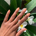 Hand with nails polished in JO dusty apricot shade for a smooth and stylish at-home manicure look
