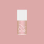 Olive and June Sandy Scallop gel polish bottle showing a creamy milky golden iridescent quick dry polish