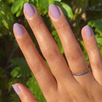 Hand showing nails painted in blooming purple Prairie polish for a smooth, long-lasting manicure by Olive and June