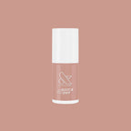 Bottle of Howdy neutral beige nail polish with quick dry formula on matching beige background