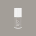 Bottle of Olive and June Koala quick dry nail polish in neutral soft grey shade on matching background