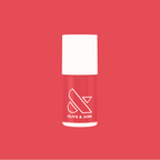 Bottle of Field Day nail polish by Olive and June in juicy watermelon red for vibrant at home mani looks