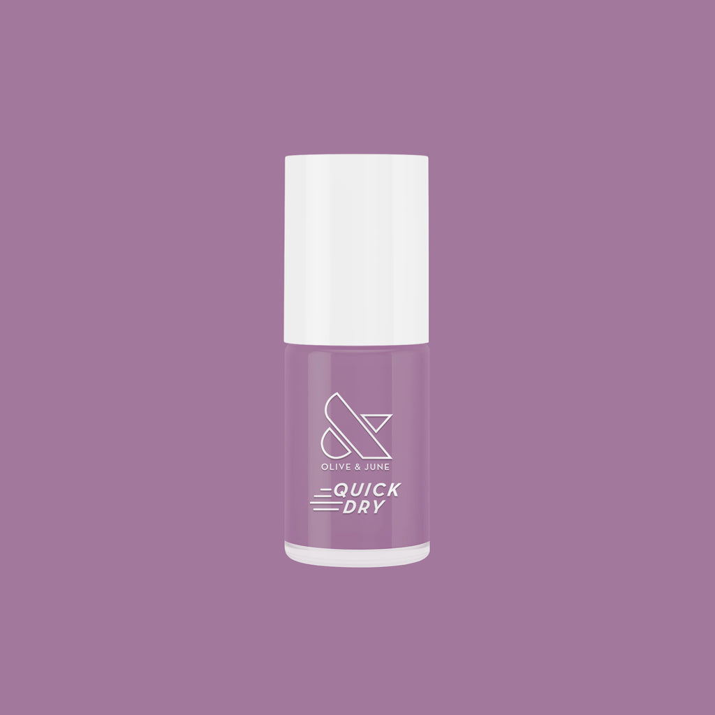 Bottle of Prairie quick dry nail polish in soft blooming purple by Olive and June for easy at-home manicures