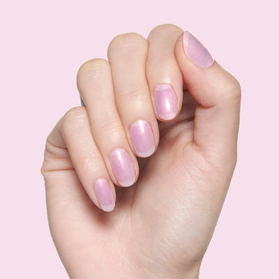 Pink Goldfish sheer pink iridescent nail polish on hand, perfect for soft at-home manicures and layering effects Pink Goldfish pink iridescent Nail Polish
