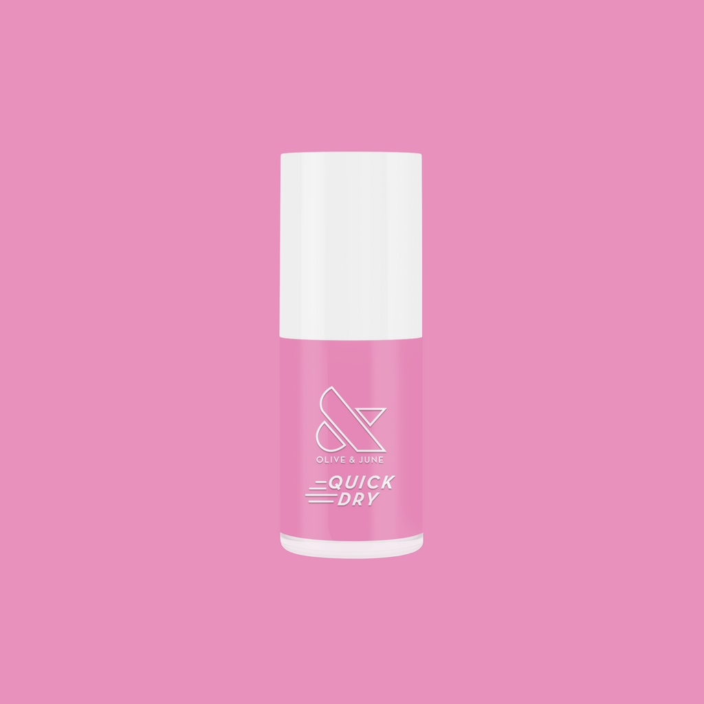 Bottle of Taffy quick dry gel polish in bright pink by Olive and June on a solid pink background