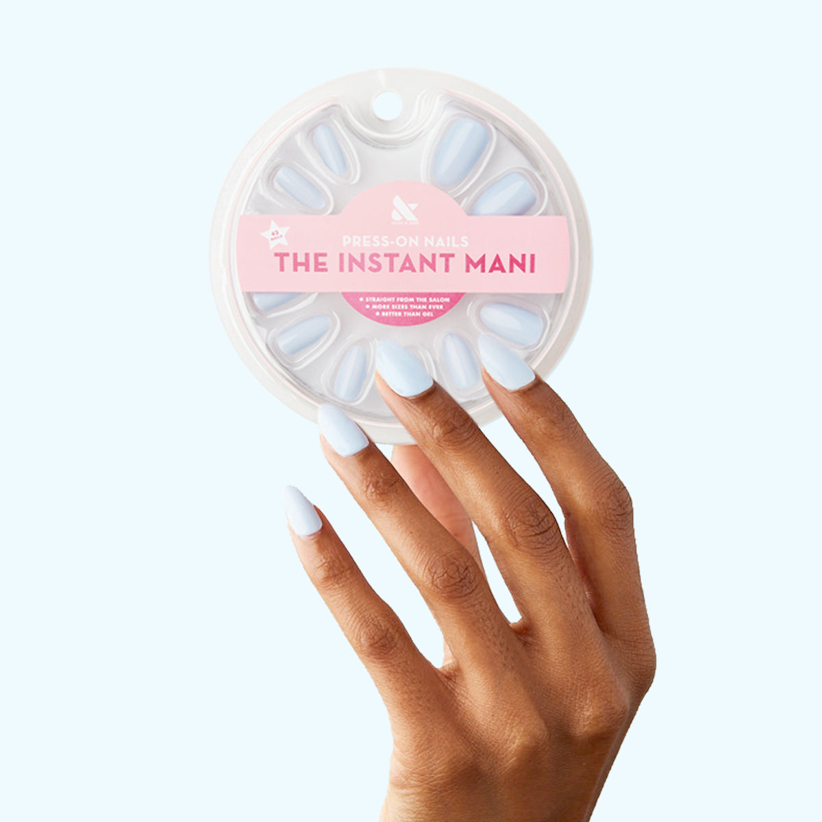 BP - Press-On | Medium | Almond showing hand with medium almond light blue press-on nails next to packaging