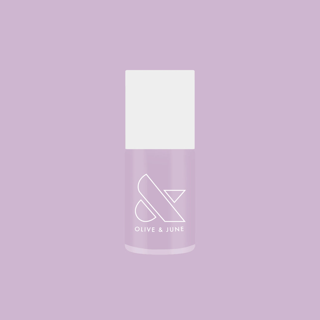 Bottle of Lavender Stems gel polish by Olive and June on a lavender background for at-home manicures