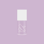 Bottle of Lavender Stems gel polish by Olive and June on a lavender background for at-home manicures