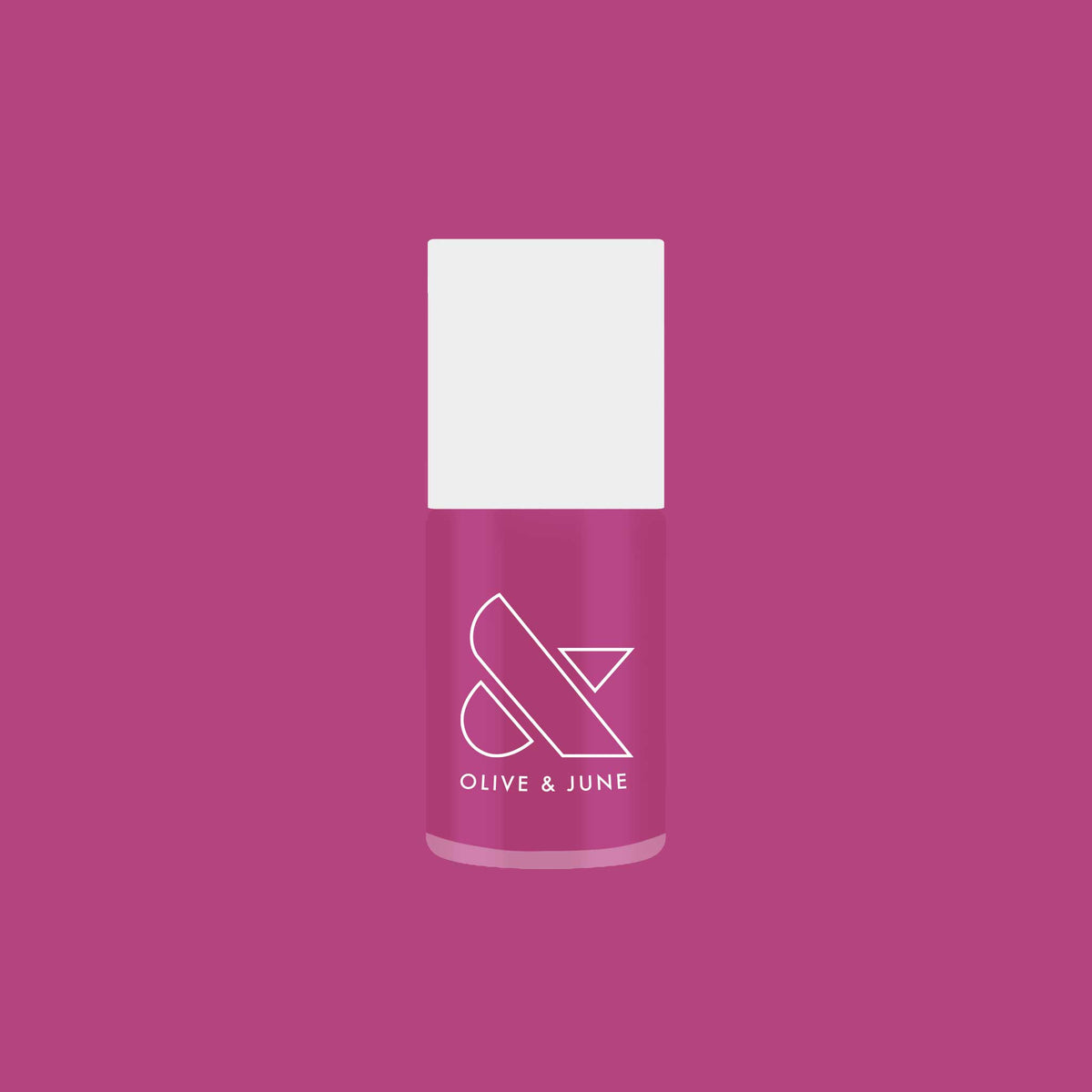 Bottle of Olive and June’s This Lettuce is Radicchio magenta-purple nail polish on matching background