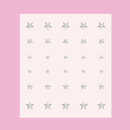 Sheet of silver Stars nail art stickers in multiple sizes for Stars manicure and mani decoration on a pink background