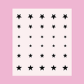 Sheet of black star stickers in varying sizes for Stars nail art and manicure decoration on a pale pink background thumbnail